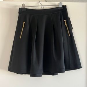 Black elevated skater style skirt. Size 4 petite.